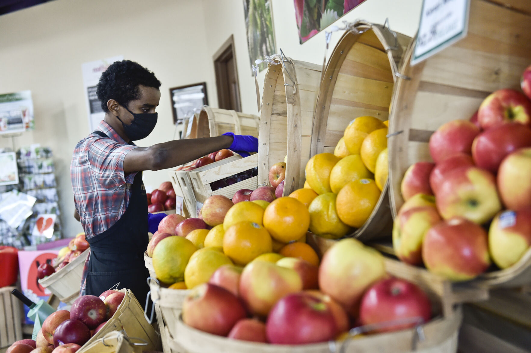 Aidan Reed works with produce